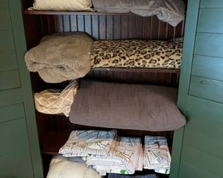 Nice selection of bedding/linens.