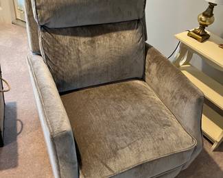Easy chair with gray upholstery.