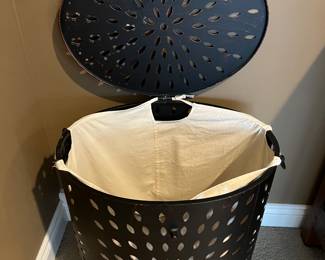 Second of two matching lidded metal hampers, this one with the lid up.