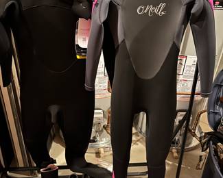 Xcel wetsuit with tags (left in photo); O’Neill wetsuit (right); accessories.