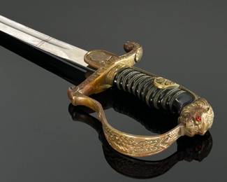 WWII German Lion Head Officers Presentation Sword With Scabbard	Total Sword Length: 35.75in  With Scabbard: 37.5in	124004