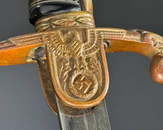 WWII German Lion Head Officers Presentation Sword With Scabbard	Total Sword Length: 35.75in  With Scabbard: 37.5in	124004