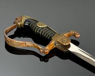 WWII German Lion Head Officers Presentation Sword With Scabbard	Total Sword Length: 35.75in  With Scabbard: 37.5in	124004