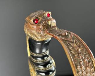 WWII German Lion Head Officers Presentation Sword With Scabbard	Total Sword Length: 35.75in  With Scabbard: 37.5in	124004