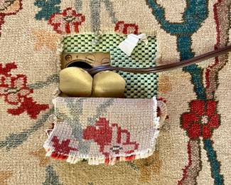 SOLD-RUG close up view of outlet cut out. - large scale rug - neutral taupe main color of the rug, one condition report noted - there has been a cut created for electrical outlet but can be easily repaired - 19fx14f