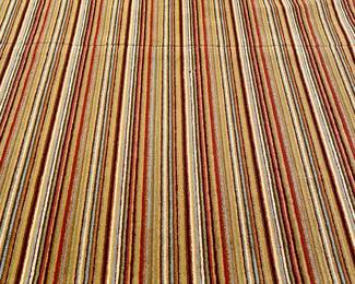 $500 - striped, looped rug with warm earth tones, custom bound, 2 seams