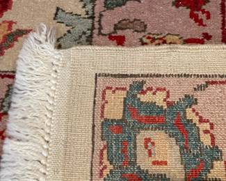 SOLD RUG close up view - large scale rug - neutral taupe main color of the rug, one condition report noted - there has been a cut created for electrical outlet but can be easily repaired - 19fx14f