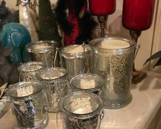 Following pictures feature beautiful decor including these candle holders.