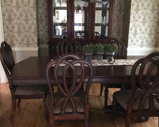 Beautiful China Cabinet (lights on hinges), 1 leaf), Table and 6 Ribbon Back Chairs. Excellent condition . Purchased from Crowley Furniture