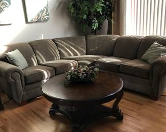 Beautiful Ashley 3 pc sectional. Wonderful 42" Round coffee table with matching end table..all from Crowley Furniture Store