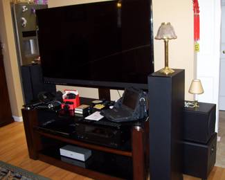 IN LIVING ROOM 55" VIZIO SMART M3D550KDE FLAT SCREEN WITH OR WITHOUT TV CONSOLE - PAIR OF POLK AUDIO MONITOR 60 SERIES II FLOOR TOWER SPEAKERS - SANYO AV RCEIVE TX-NR656 - PANASONIC BLU RAY DISC PLAYER - SONYSS-CN335 CENTER CHANNEL SPEAKER - MEGO 1970'S 2XL 8 TRACK PROGRAM TAPES STOYLAND & TIME MACHINE - VIDEO CAMERA - ETC