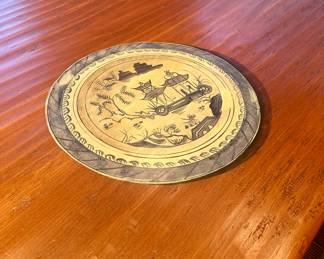 Trompe L'oeil plate painted on top of table