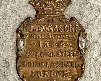 detail- brass plaque on the metal container