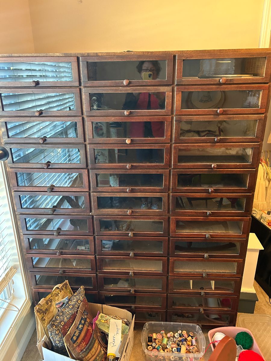 Haberdasher glass cabinetry, two sections stacked