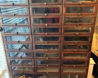 Haberdasher glass cabinetry, two sections stacked