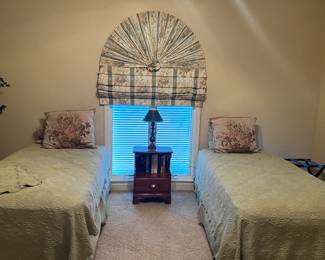 Pair of twin beds
Green matelasse' spreads and shams
Tapestry Shams