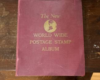 Postage stamp album with stamps