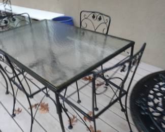 table and chairs with cushions