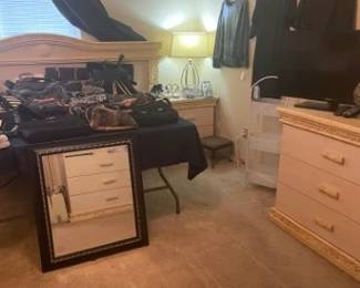 Room view with purses and clothing