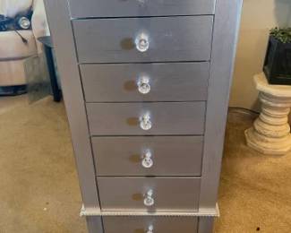 Jewelry cabinet.  Gently used.  6 drawers with lift up mirror and 2 side 'arms' for necklaces.  