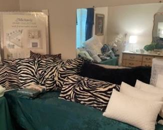 Decorative pillows and wall mirror