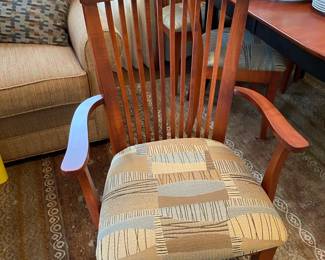 Close up up arm chair with contemporary cushioned seat