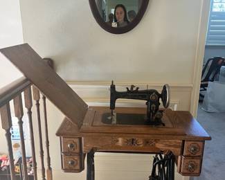 Antique sewing machine w/cabinet