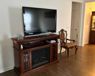 Large electric fireplace with glass storage, flat screen tv