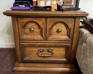 Five-piece bedroom set including two nightstands, armoire, and dresser with two mirrors