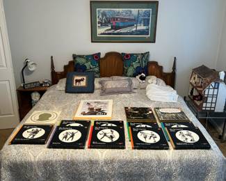 Five-piece bedroom set including two nightstands, armoire, and dresser with two mirrors