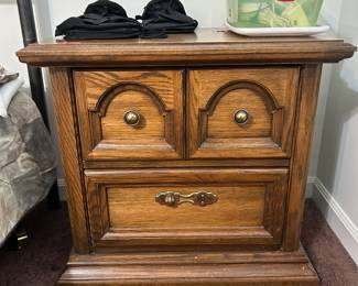 Five-piece bedroom set including two nightstands, armoire, and dresser with two mirrors