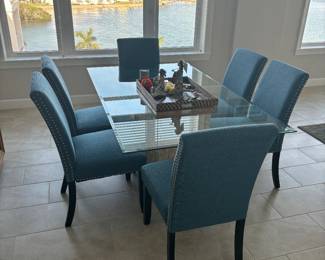 Pedestal dining room table glass, top 6‘ x 3 1/2‘ $250
dining room chairs $300