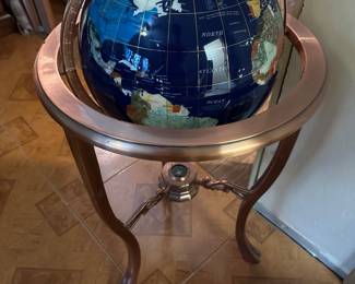 Glass globe with metal stand