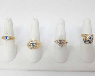 #714 • 4 14k Gold Rings With Rhinestones, Ruby and Aqua
