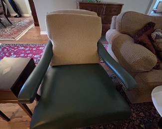 Leather and nailhead chair with rollers. From Old Hickory