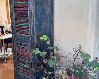 Mexican cabinets, cross sconce, vases, dried and silk flowers