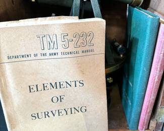 Antique surveyor equipment, manuals, and logs
