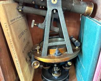 Antique surveyor equipment, manuals, and logs
