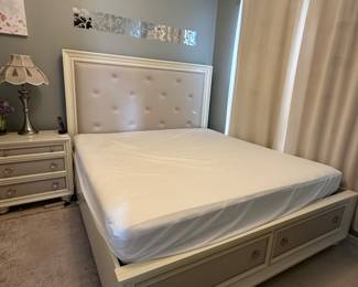 King Suite with storage footboard, dresser with mirror and a nightstand $750
