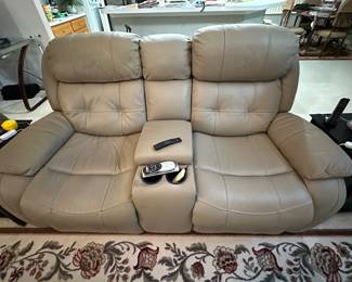 Electric reclining loveseat with console. $500