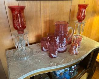 Pair of Glass Candelabras with Cranberry Shades and Mary Gregory Cranberry Glass Pitcher, Glasses and Bell 