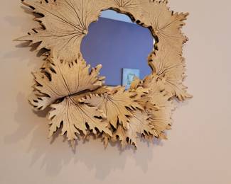 Leaf carved framed mirror.