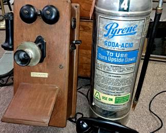 Much antiques, primitives and collectibles. Antique wall phone and vintage black rotary dial phone