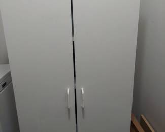6 foot tall by 2 foot wide storage cabinet perfect for laundry or garage.