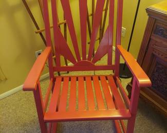 Red wooden rocking chair.