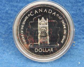 Lot 83. 1977 Canadian Proof Silver Dollar commemorating Queen Elizabeth II Silver Jubilee. 25.175 grams grams with 92.5% silver.