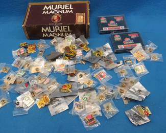 Lot 213. Cigar box full of commemorative pins most of which are regarding Super Bowls and other NFL Games