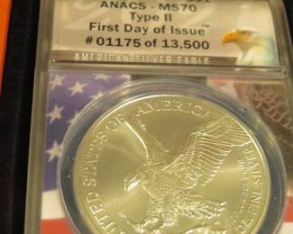 Lot 11. 2021 American Silver Eagle First day of issue containing 1 oz. pure silver graded by ANACS-MS70 Type II in an attractive wooden display box.