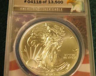 Lot 10. 2021 American Silver Eagle First Day of Issue containing 1 oz. pure silver graded by ANACS-MS70 in an attractive wooden display box.