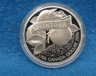 Lot 82. 1996 Canadian Silver Dollar commemorating the discovery of the MacIntosh Apple. 25.175 grams with .925 silver.